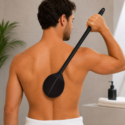 Applying self-tanner evenly on the back with Evolvience Reach back applicator for streak-free results.